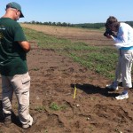 Bob and Caroline measuring and surveying the find.